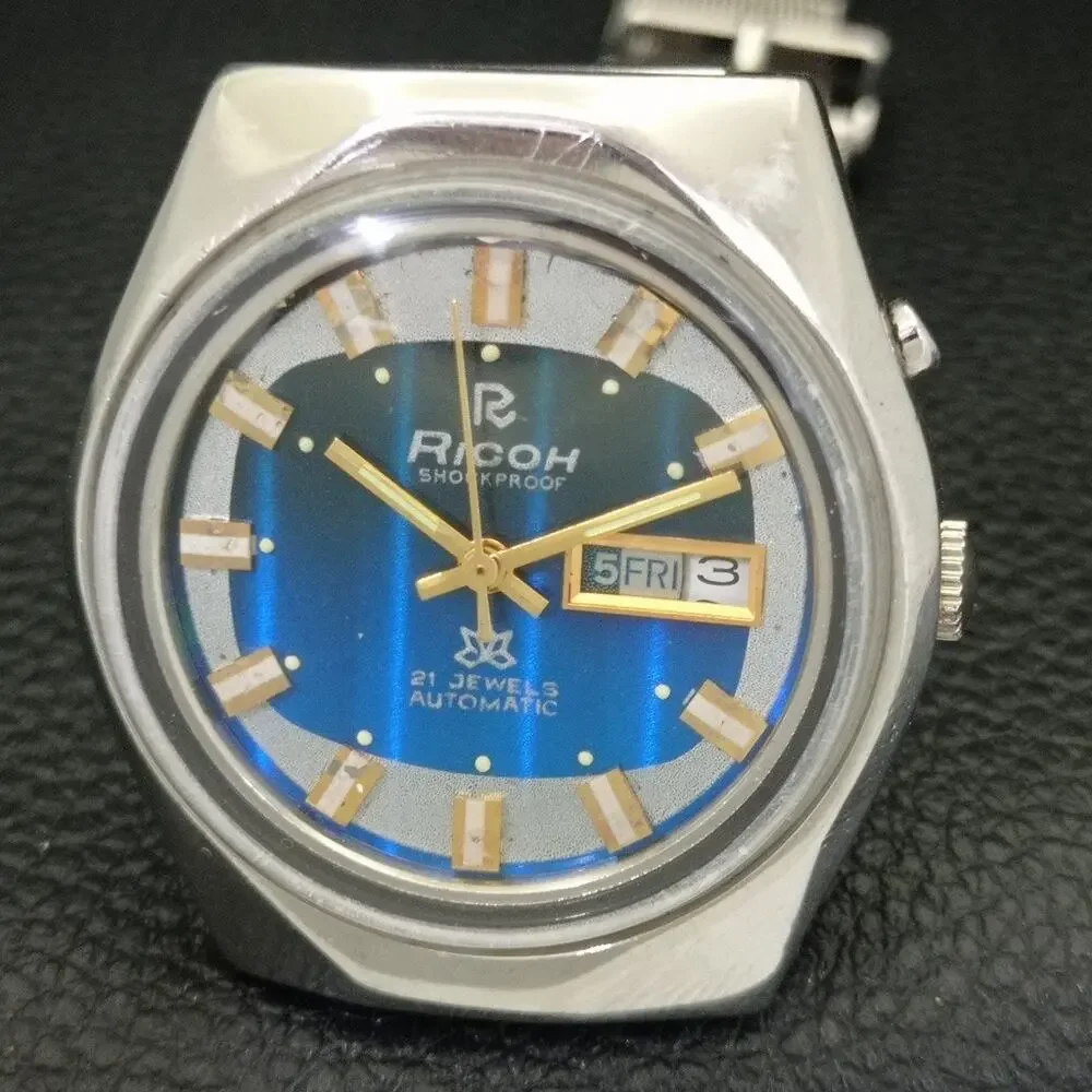 Vintage 1973 Ricoh Automer atic Mens SilvWatch W/daydate & Blue accents